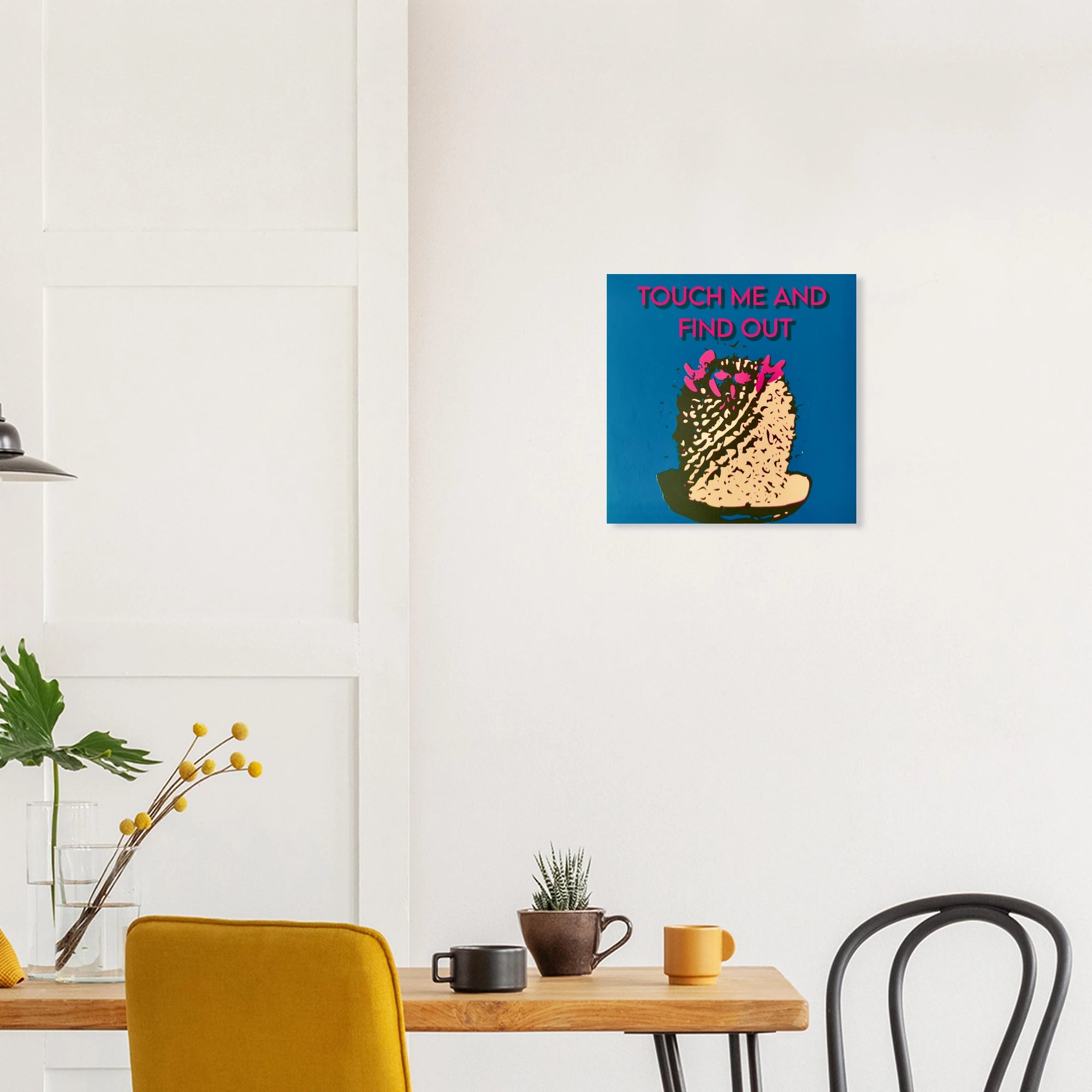 Touch Me and Find Out cactus print in warm bohemian room with macrame wall hanging