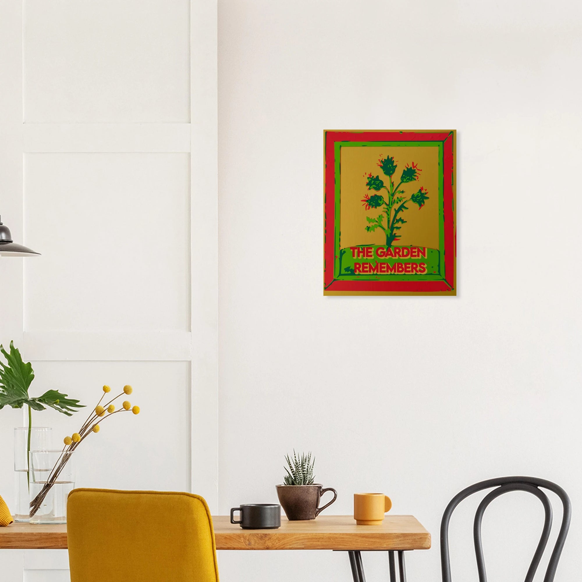 The Garden Remembers thistle print on textured dark wall above white sofa