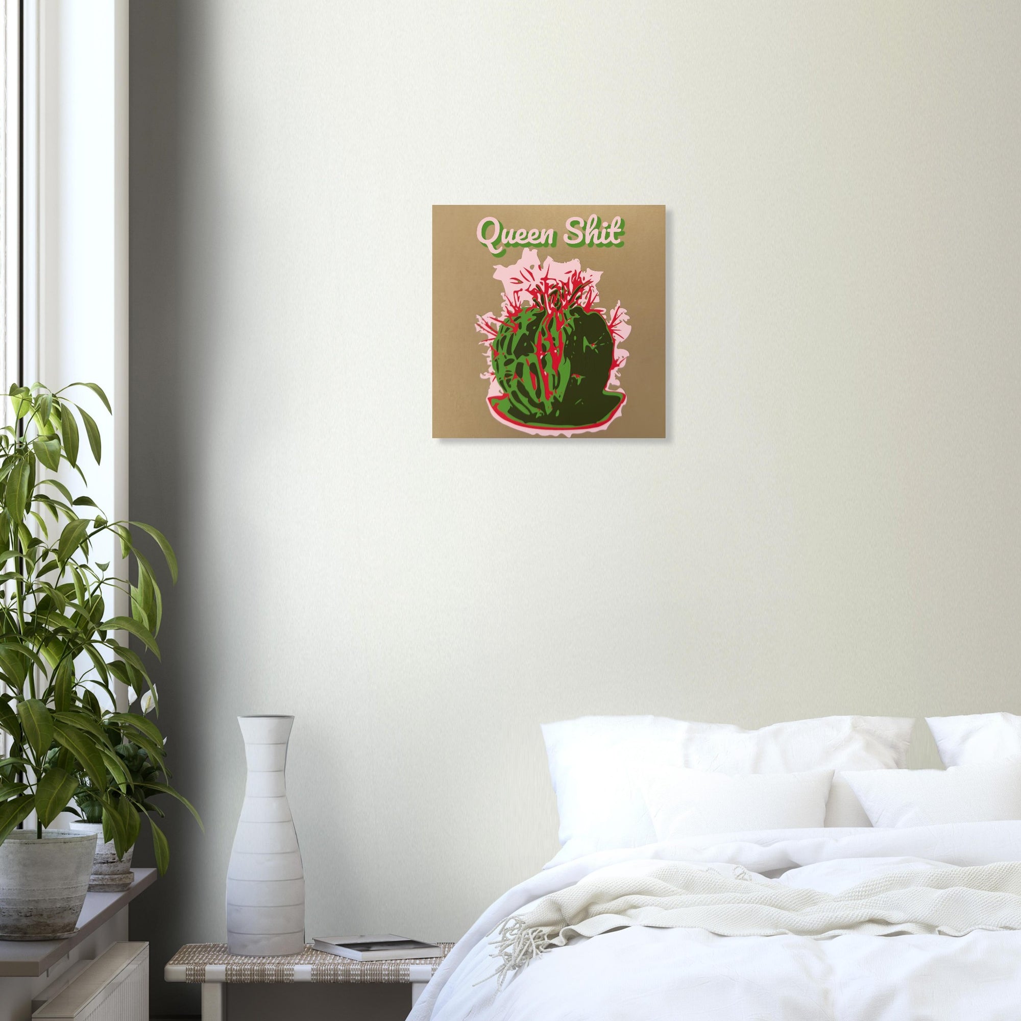 Queen Shit cactus crown print on textured dark wall above white sofa