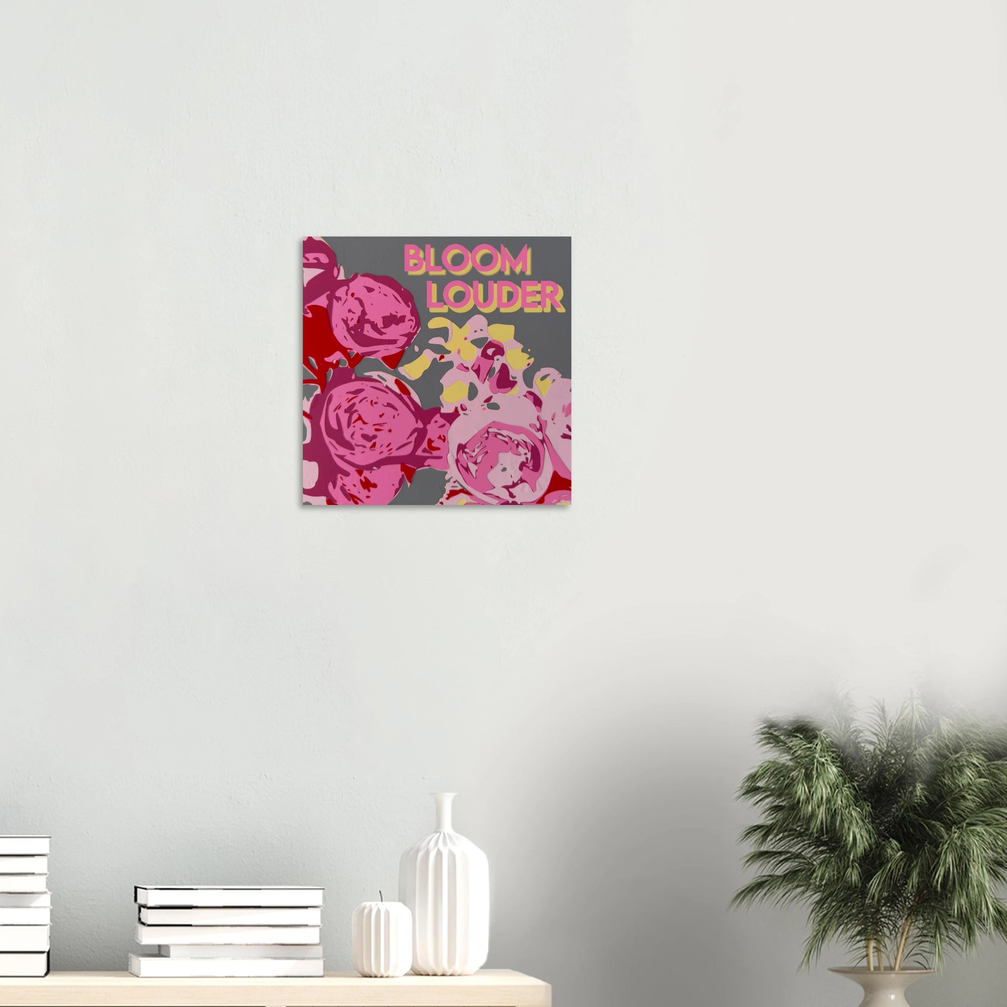 Bloom Louder garden roses print on textured dark wall above white sofa