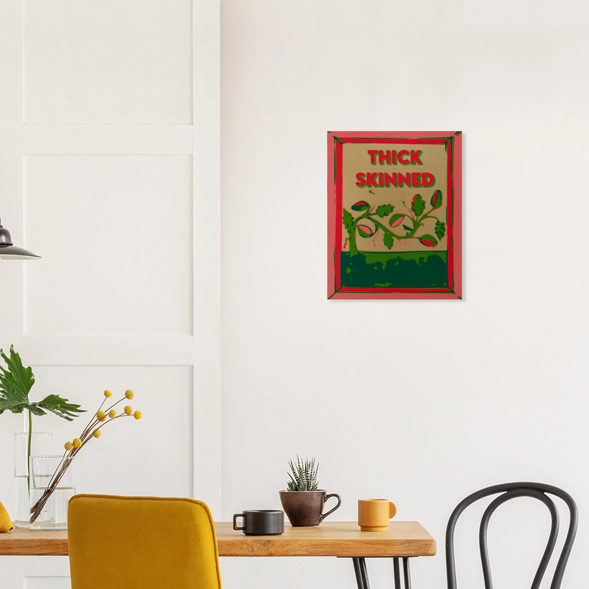 Thick Skinned watermelon vine print on textured dark wall above white sofa